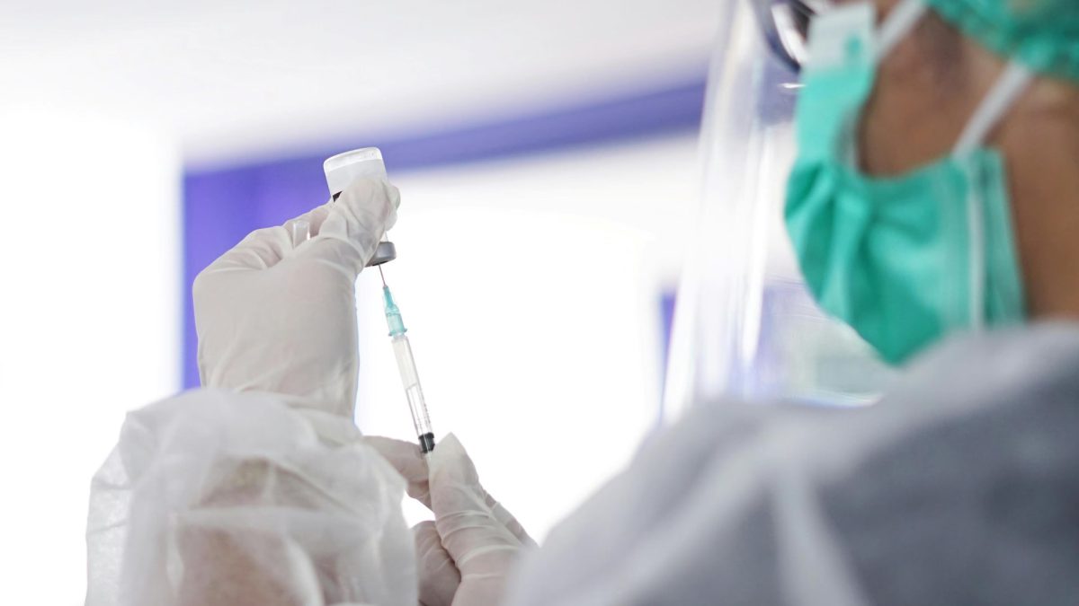 Scientist preparing a vaccine dose in a medical laboratory