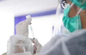 Scientist preparing a vaccine dose in a medical laboratory